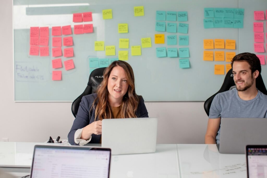 Business professionals coordinating a customer support outsourcing implementation plan