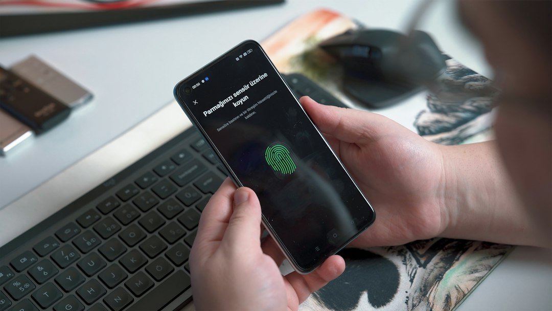 Applicant using a smartphone for digital identity verification during fintech onboarding